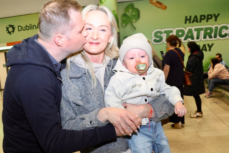 Kuba Sieriowski with his wife Kasia and son Kyle at Dublin Airport after he returned from Dubai. Photograph: Ronan McGreevy