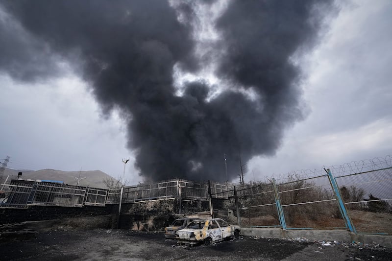A thick plume of smoke rises from an oil storage facility hit by a US-Israeli strike in Tehran. Photograph: Vahid Salemi/AP