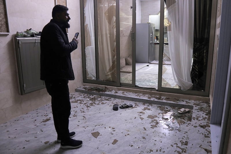 People inspect damage at a building whose windows were shattered following air defences' interception of a projectile or drone over a residential neighbourhood in Arbil, the capital of Iraq's northern autonomous Kurdish region, on March 4th, 2026. Photograph: Safin HAMID / AFP via Getty Images