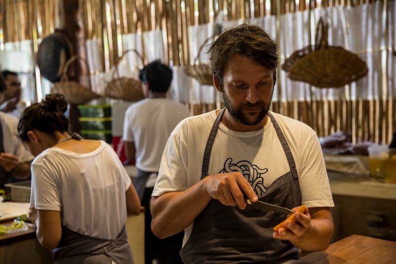 René Redzepi cuts a mango at a Noma pop-up in Tulum, Mexico, April 19th, 2017. Photograph: Adriana Zehbrauskas/The New York Times                     