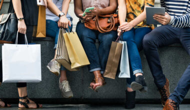 People with shopping bags.
