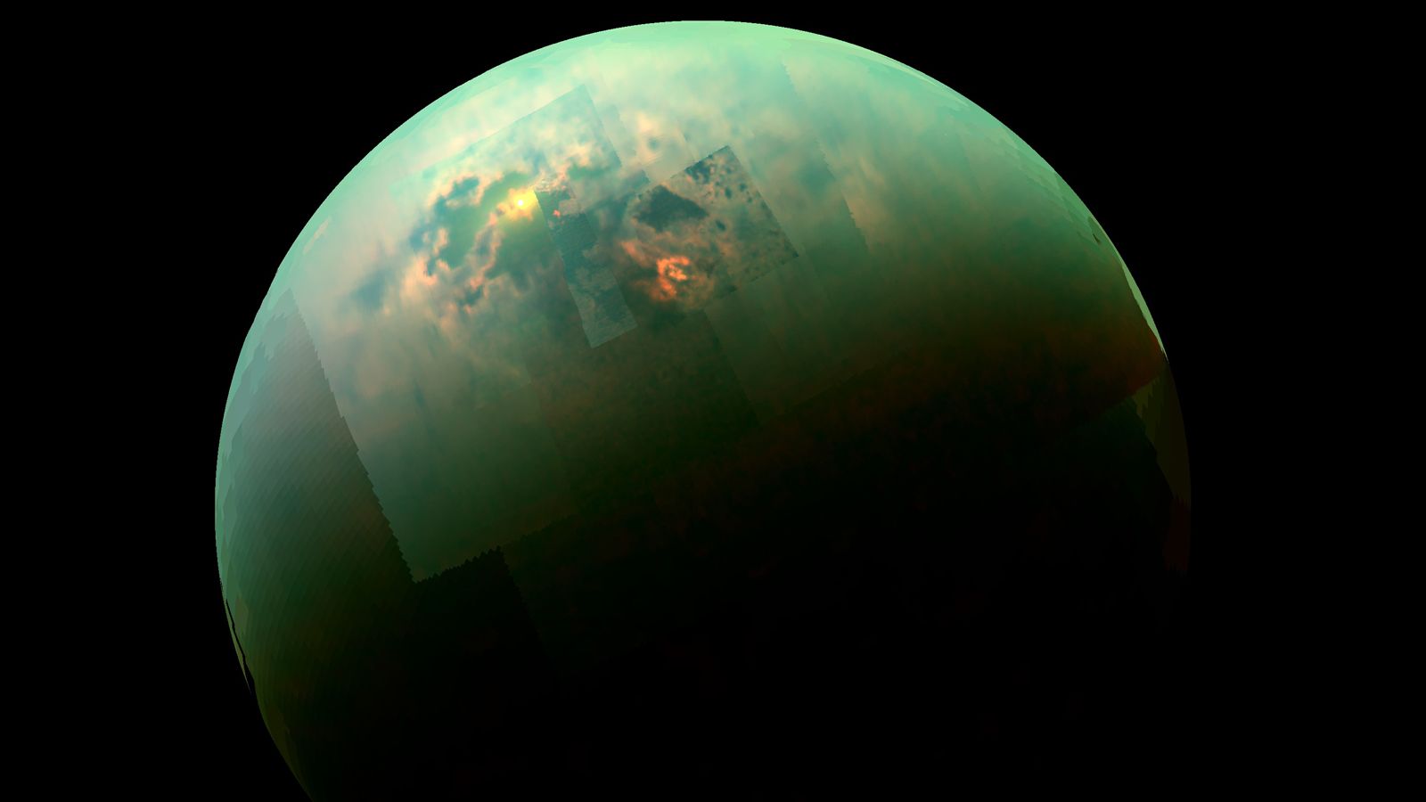 a mottled green and yellow orb on a black background