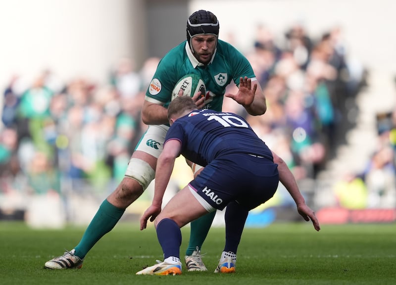 Ireland's Caelan Doris runs at Scotland's Finn Russell during the game at the Aviva Stadium. Photograph: Brian Lawless/PA Wire