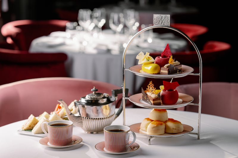 We linger luxuriously over beautifully presented finger sandwiches, scones and Parisian-style cakes