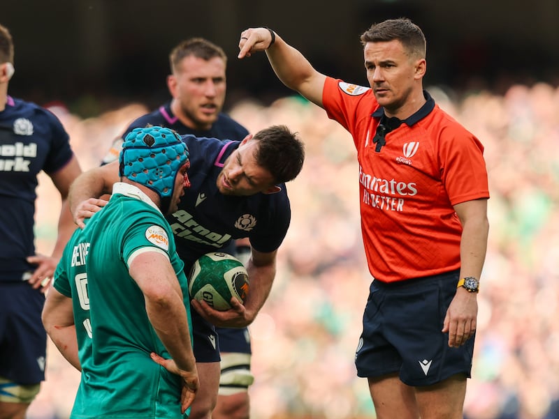 Assistant referee Luke Pearce signals to the sideline for Ireland's Tadhg Beirne to receive medical treatment. Photograph: Ryan Byrne/Inpho