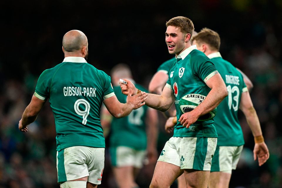 Jack Crowley of Ireland, centre, and team-mate Jamison Gibson-Park celebrate against Wales