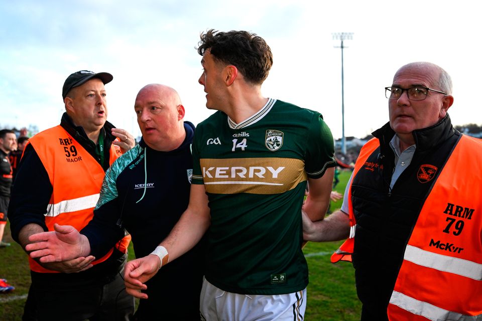 Kerry's David Clifford is escorted off the field on the final whistle of yesterday's NFL Division 1 clash with Armagh at BOX-IT Athletic Grounds in Armagh. Photo: Ray McManus/Sportsfile