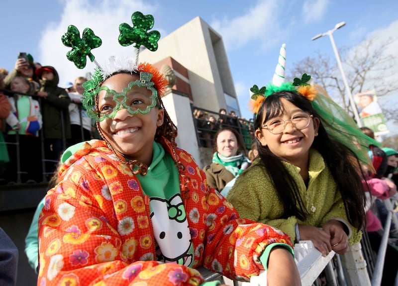Eight-year-olds Kaizen Aquino and Hillary Tapiwan watch the Dún Laoghaire parade. Photograph:  Mark Stedman