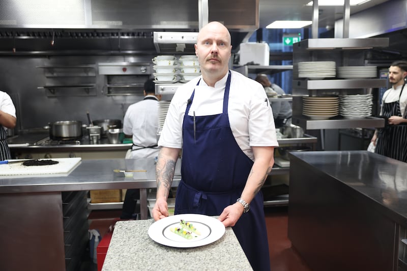 Chapter One chef patron Mickael Viljanen with a white asparagus dish garnished with herbs grown at Belvedere College.  Photograph: Enda O'Dowd