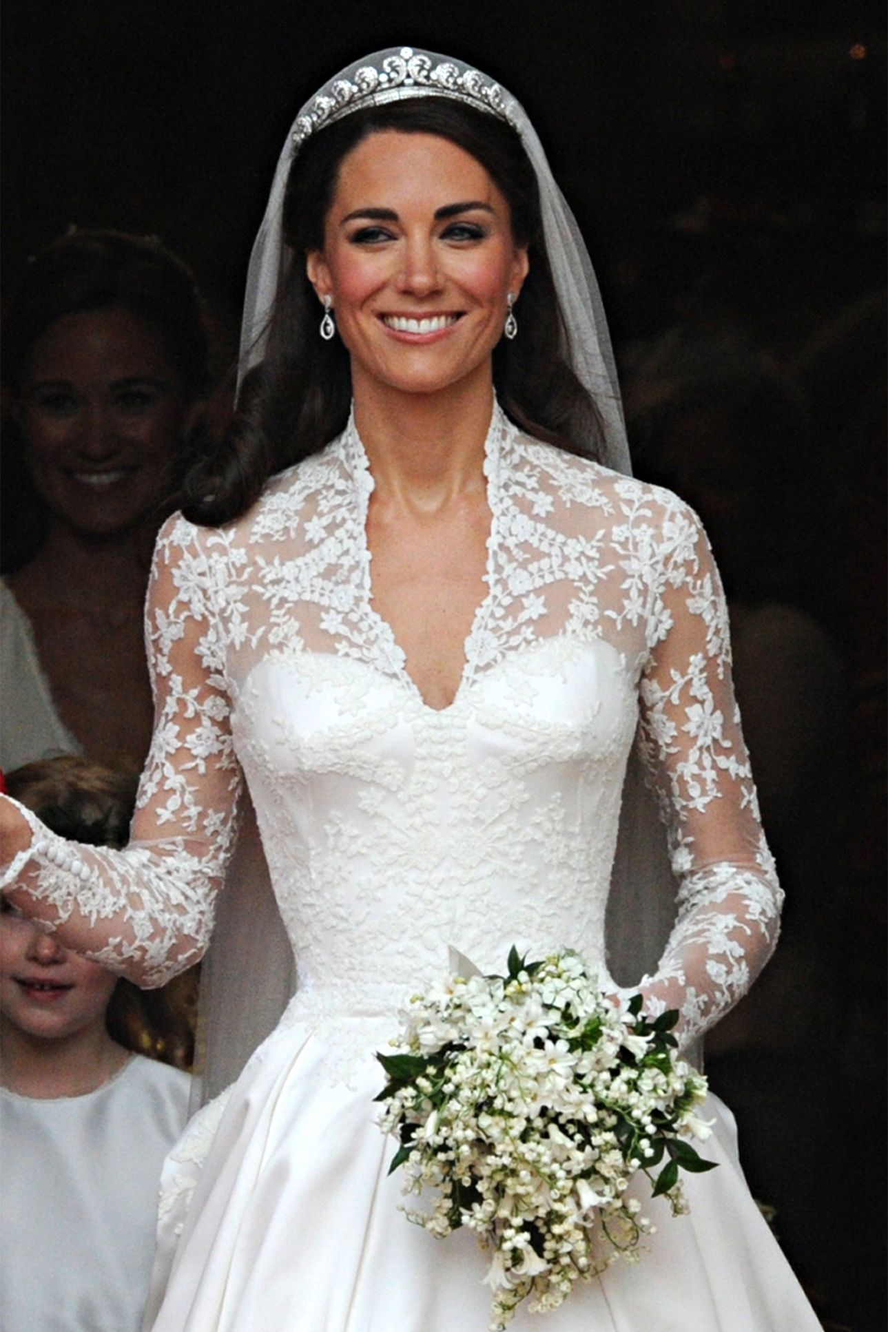 Image may contain Pippa Middleton Clothing Dress Fashion Formal Wear Gown Wedding Wedding Gown and Flower