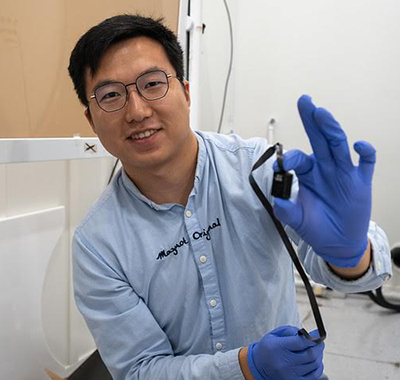 Troy Bu holds vagus nerve stimulation device