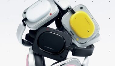 Nothing Headphone (a) wireless headphones stacked on top of one another