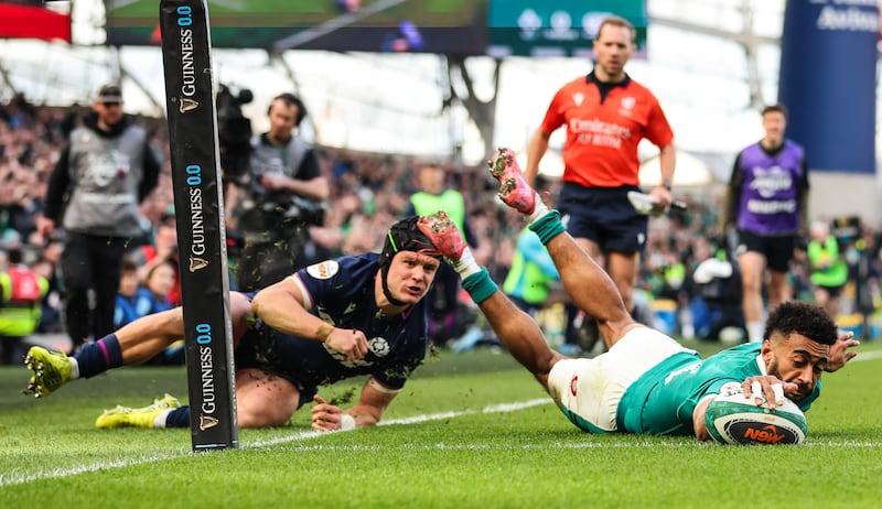 Ireland’s Robert Baloucoune scores his side's third try against Scotland. Photograph: Ryan Byrne/Inpho