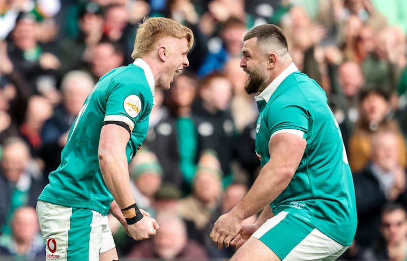 Tommy O’Brien celebrates after scoring Ireland's fifth try with Michael Milne. Photograph: Nick Elliott/Inpho