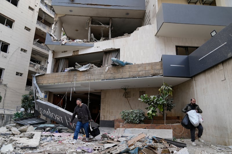 Hotel guests carry their belongings, as they leave a damaged hotel that was hit by an Israeli airstrike in Hazmieh east of Beirut, Lebanon, Wednesday March 4th, 2026 Photograph: Hussein Malla/AP