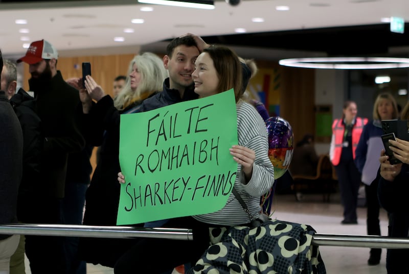 Family members wait for their loved ones to arrive at Dublin Airport following an Irish Government chartered flight from Oman, which stopped at Cairo, before touching down in Dublin in the early hours of Sunday. Photograph: Evan Treacy/PA Wire 