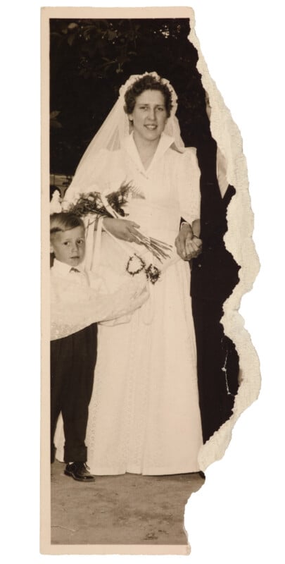 A vintage torn photograph shows a bride in a white dress and veil, holding a bouquet and the hand of a young boy dressed in formal clothes, standing beside her. Both look toward the camera.