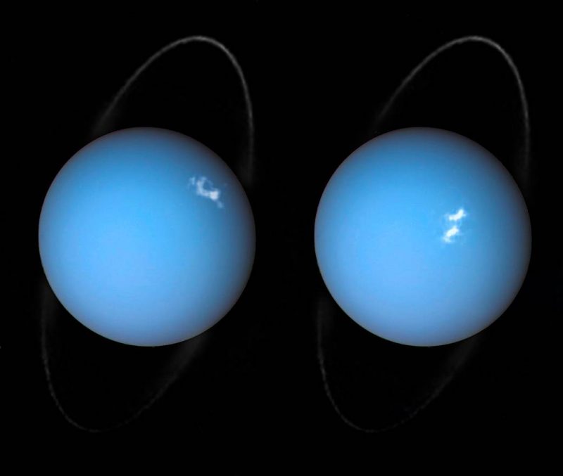 Two bluish planets with white spots and thin rings on black background.