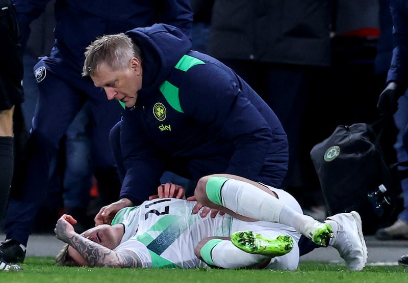 Ireland manager Heimir Hallgrímsson checks on Sammie Szmodics after he was knocked unconscious in a collision during extra time of Thursday's match against Czech Republic at Fortuna Arena, Prague. Photograph: Ben Brady/Inpho