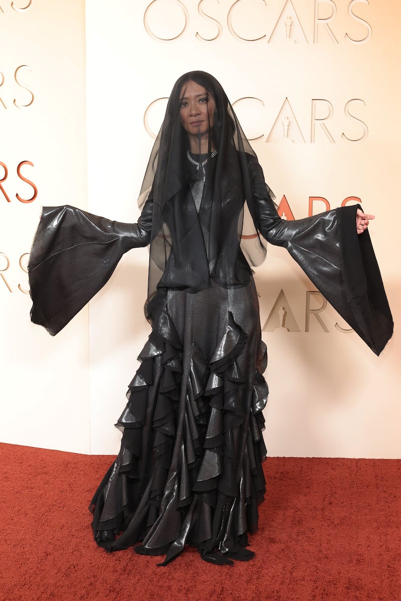 Hamnet director Chloé Zhao in a black gown and veil. Photograph: Mike Coppola/Getty Images