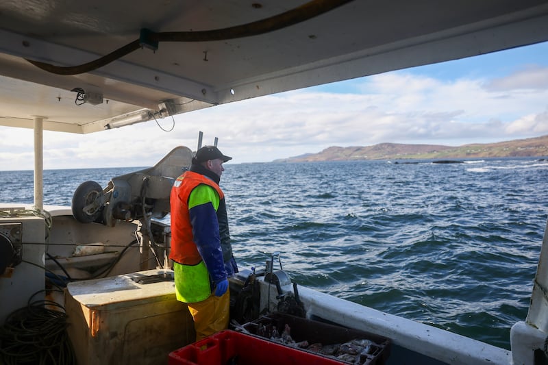 Menarry looks out from his vessel. Photograph: Enda O'Dowd