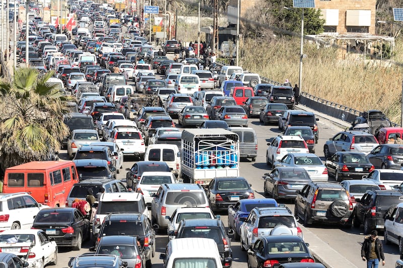 Motorists block the highway as they flee their villages in southern Lebanon along the coastal road through the city of Sidon on March 2, 2026. (Photo by MAHMOUD ZAYYAT / AFP via Getty Images)