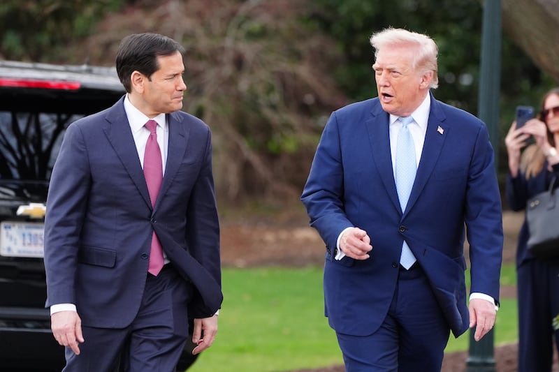 US president Donald Trump walks with US Secretary of State Marco Rubio on Saturday.  Photograph: Alex Brandon/AP