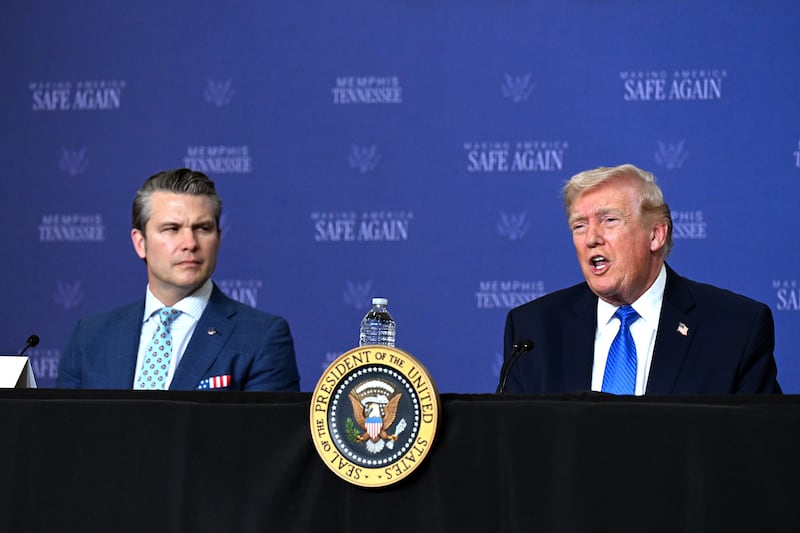 US secretary of defence Pete Hegseth with president Donald Trump in Memphis on Monday. Photograph: Roberto Schmidt/Getty Images