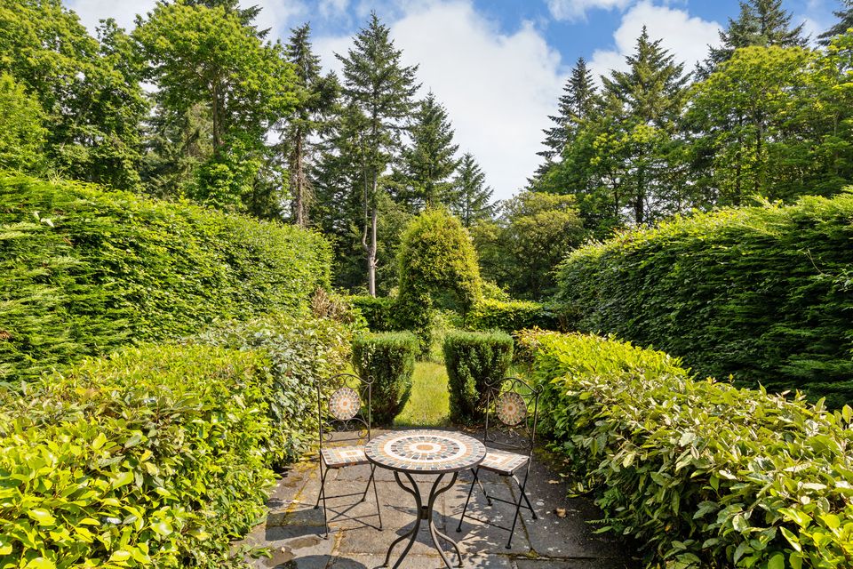 An outdoor seating area at Glanmore Castle, Devil’s Glen, Ashford, Co Wicklow