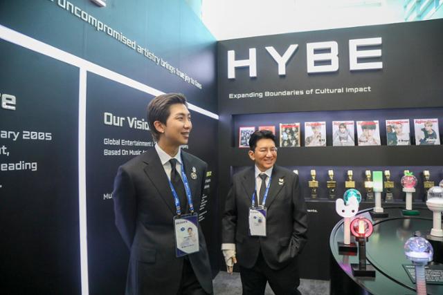 BTS' RM, left, with HYBE Chairman Bang Si-hyuk / Courtesy of HYBE