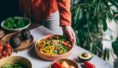 Bowl of high protein and high fibre foods on table with woman's hand reaching out towards it