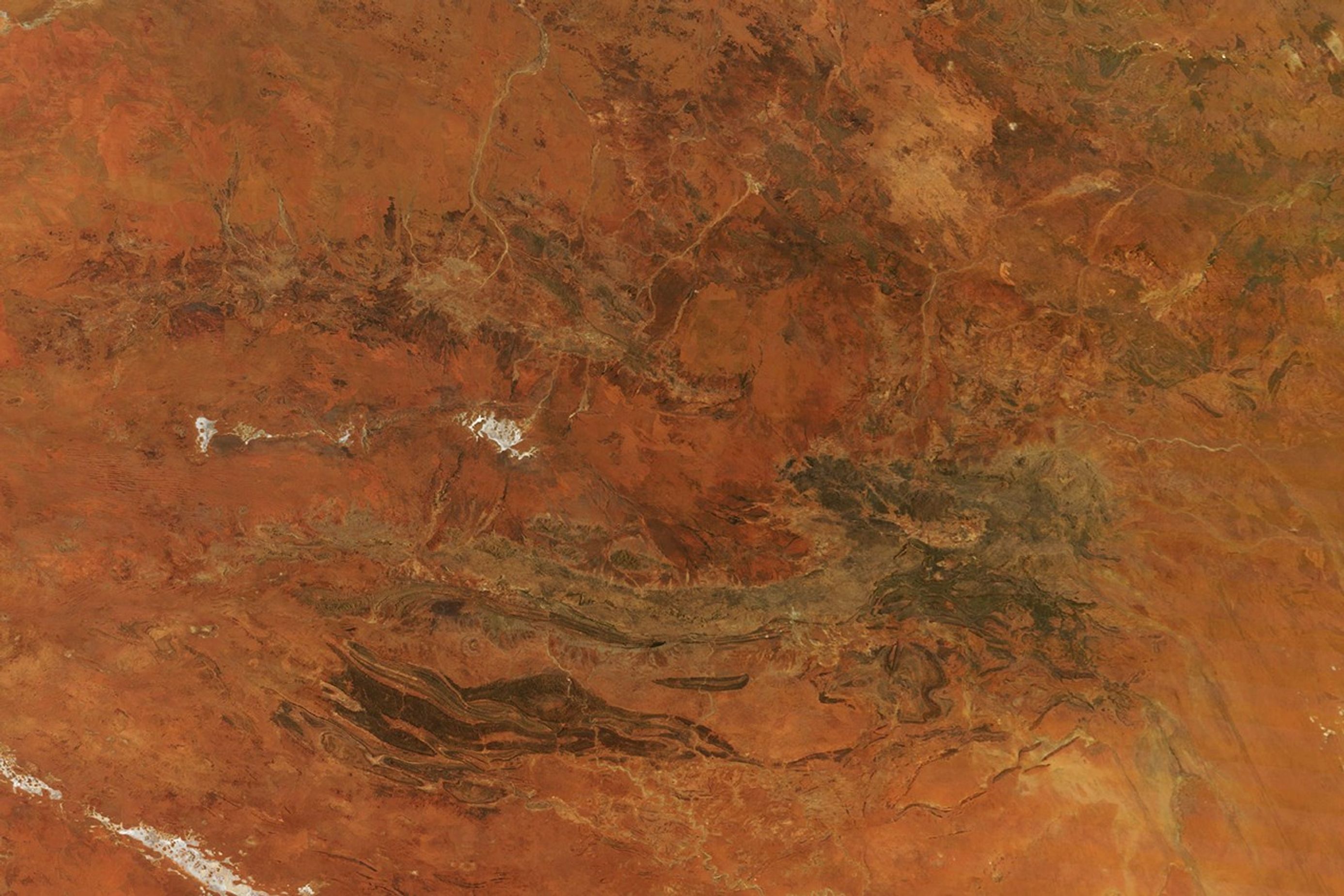 Central Australia’s desert landscape appears predominantly rusty red.