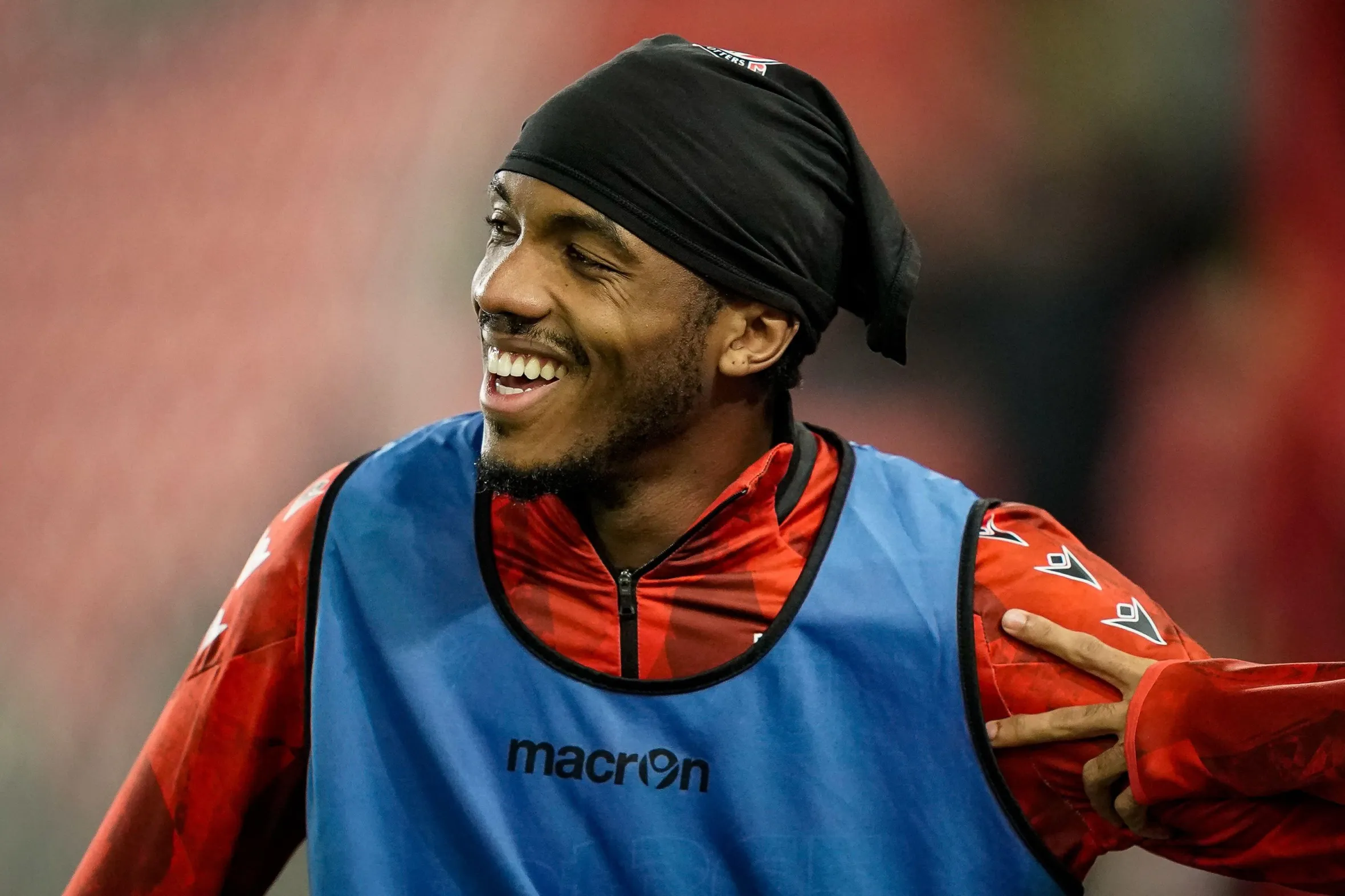 Bosun Lawal smiling during a pregame warm-up session.