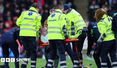 Sammie Szmodics is stretchered off the pitch