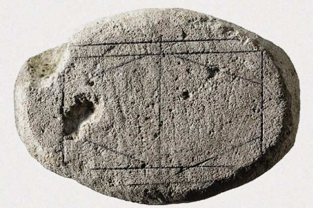 image of a carved rock, he possible game board with pencil marks highlighting the incised lines