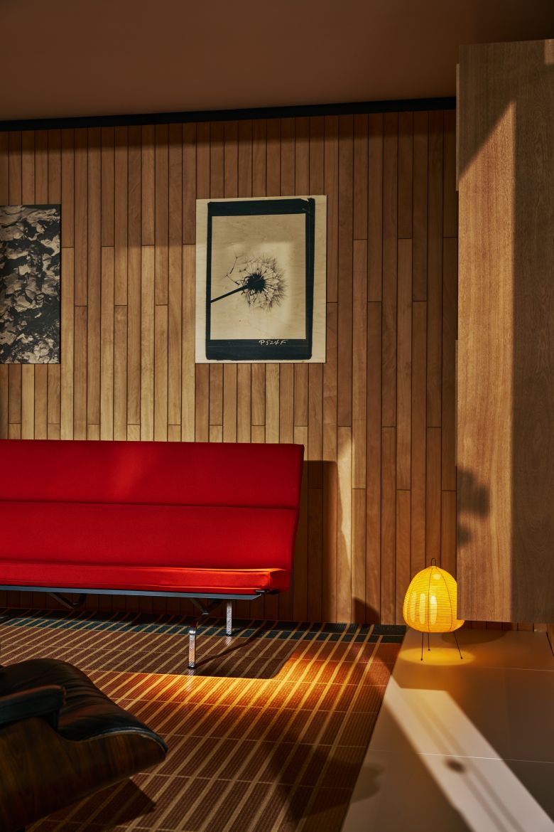 The ground floor of the Eames Pavilion, with wall covering mirroring the tallowwood wall of the Eames House, 2026.