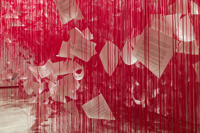 chiharu shiota's woven webs meet yin xiuzhen's clothing installations at hayward gallery - 2