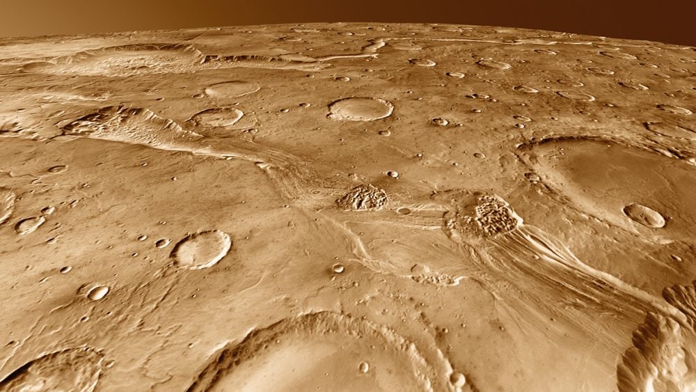 Millions of craters of all sizes help define the Martian surface and tell a tale of millions of impacts. We know that some Mars rock has reached Earth after being blasted into space by an impact. New research shows that at least one type of extremophile can survive the impact, and the hazardous journey to another world. Image Credit: NASA/JPL/Arizona State University, R. Luk