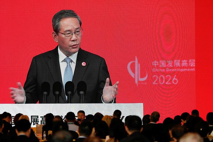 Chinese Premier Li Qiang is seen on a big screen live broadcast of his speech at the opening of the China Development Forum 2026 in Beijing, March 22. AFP-Yonhap