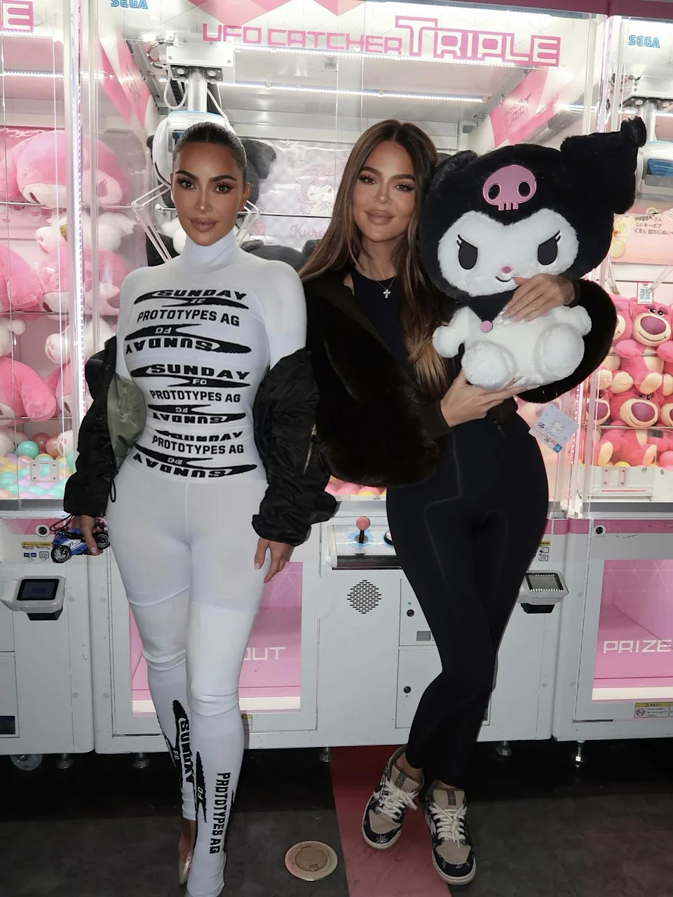 In one pic from their trip to Japan, the sisters (seen above) posed in front of claw machines in an arcade. Kim Kardashian/ Instagram