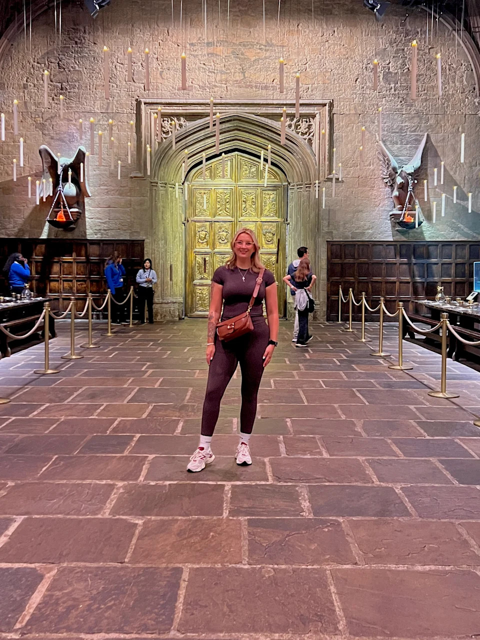 Katie poses for a picture in a castle