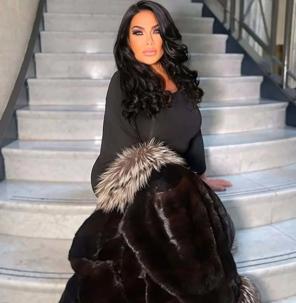 Renee Graziano (?) sitting on a staircase