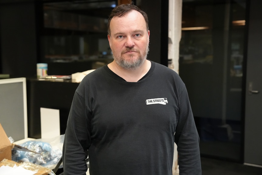 Tim Burrowes wearing a black top.