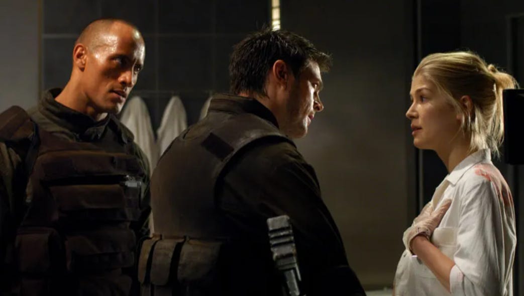 Rosamund Pike Says Her Doom Movie With The Rock Was 'Probably One of the Worst Films Ever Made' and 'Could Have Ended My Career'