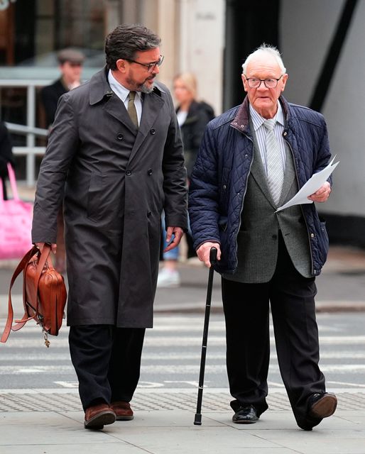 Barry Laycock (right) outside the Royal Courts of Justice, in central London, where a civil claim is being brought against former Sinn Fein president Gerry Adams for just £1 in damages by three men who were injured in Provisional IRA bombings on the UK mainland in the 1970s and 1990s. James Manning/PA Wire