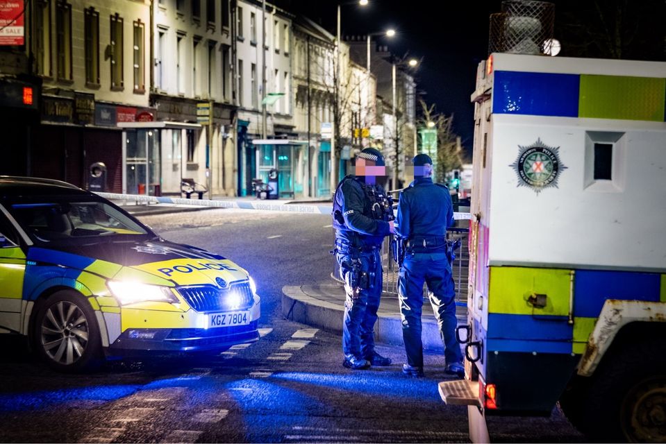 Officers at the scene outside police station in Co Armagh