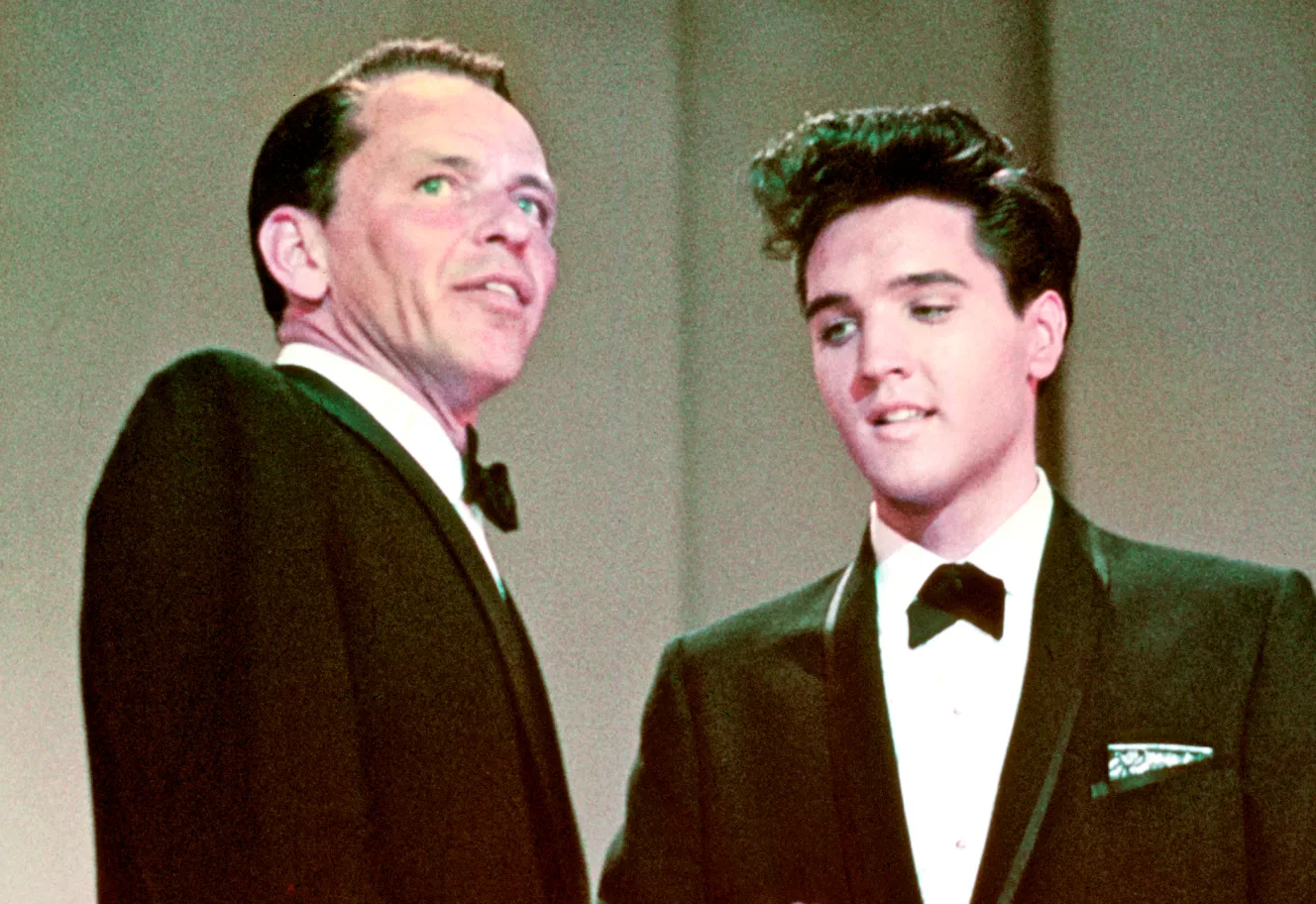 Frank Sinatra and Elvis Presley on stage.