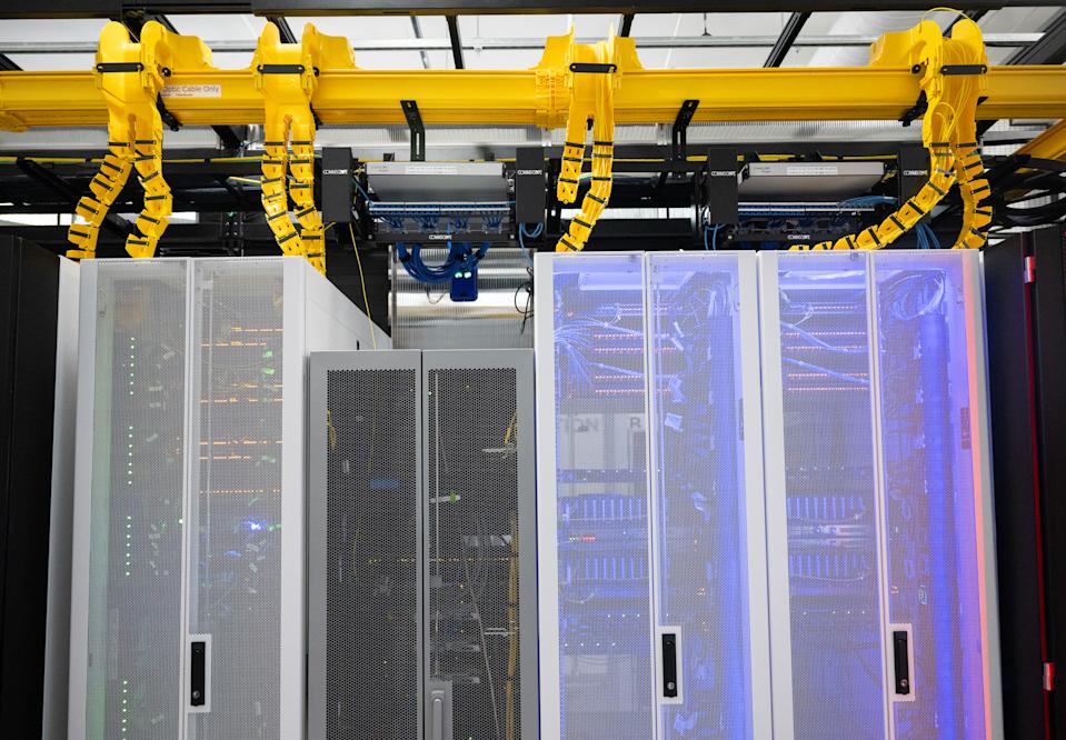 Cabinets holding racks and active servers is seen at the Digital Realty Innovation Lab (DRIL) data center in Ashburn, Virginia on November 12, 2025. (Photo by ANDREW CABALLERO-REYNOLDS / AFP via Getty Images)