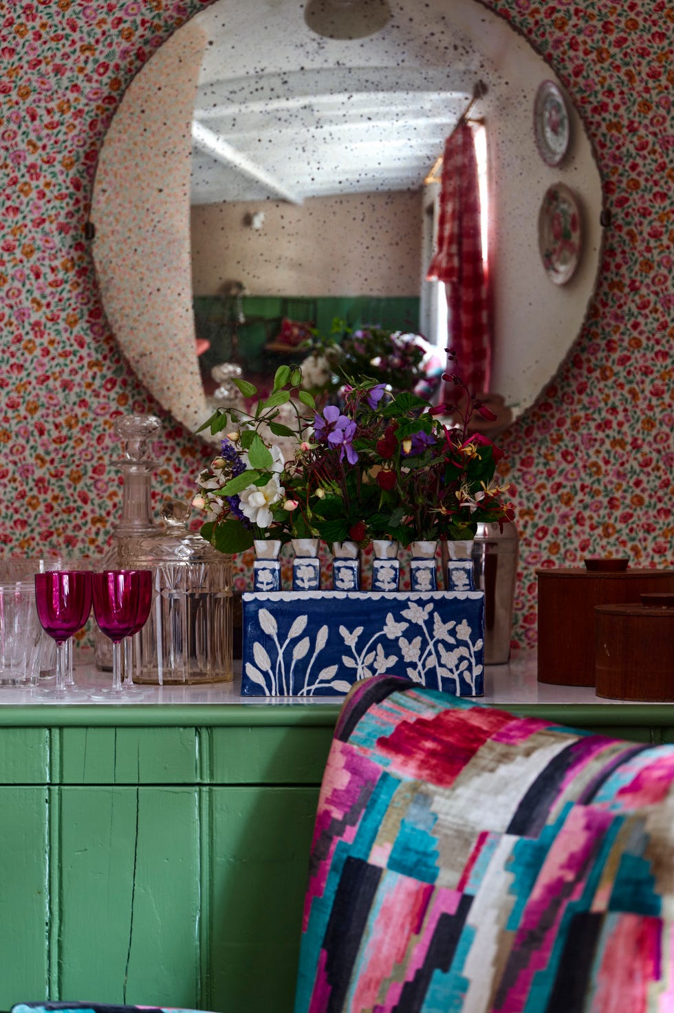 colourful cottage alcove with convex mirror