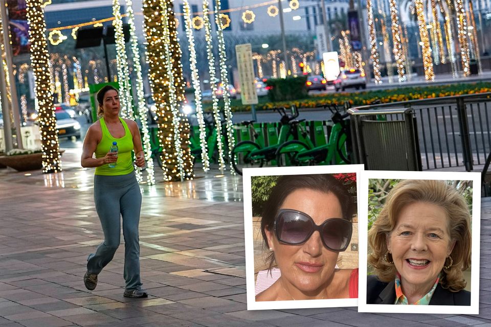 A woman jogs along a main street in downtown Dubai yesterday and, inset, Patricia Frawley and Eithne Treanor are two Irish women now resident in Dubai